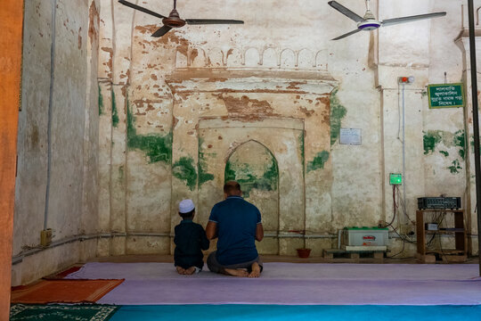 Father and son praying inside Qasba Mosque, Barisal Division, Gournadi, Bangladesh