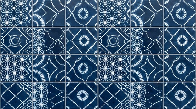 Indigo ceramic tile pattern displays shibori dyed geometric motifs for kitchen backsplashes and bathroom floors.