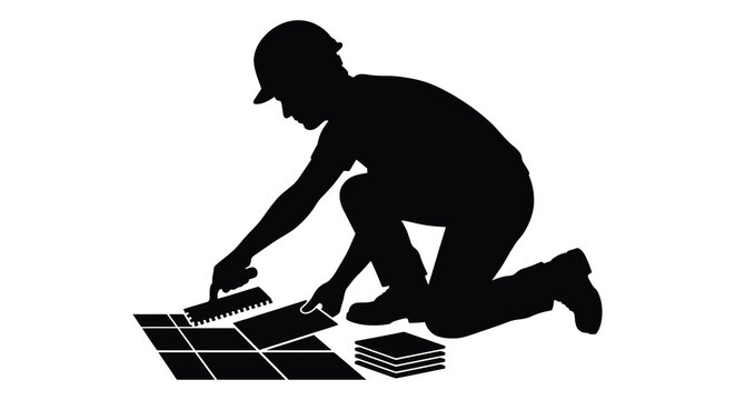 Tile setter kneeling and applying adhesive black silhouette