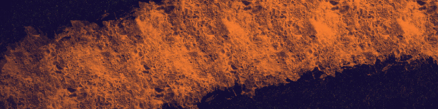 Bright orange and dark navy blue cosmic abstract texture background featuring a cratered planetary surface pattern with starry night space elements