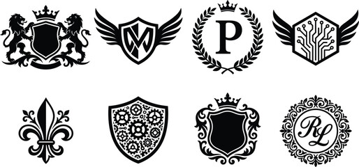 Heraldic luxury emblem collection featuring royal shields, crowned crests, winged badges, laurel wreaths, fleur de lis and ornate decorative monograms © Mst