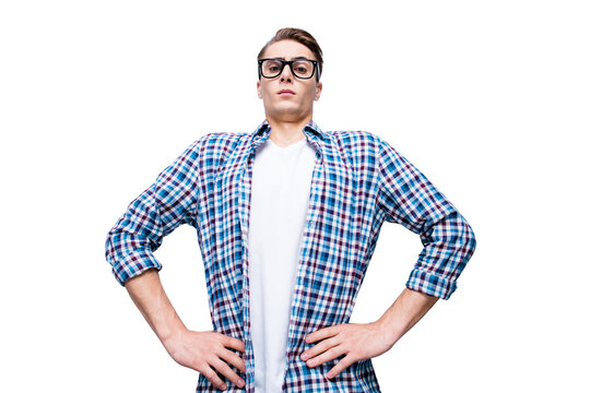 Low angle top view portrait of cpmic, handsome, attractive, sporty guy in blue checkered shirt and white t-shirt look at camera hold hands on waist isolated on light gray background