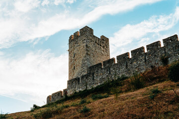 Historic stone ramparts and towers rise above the hillside at Belgrade Fortress. Medieval architecture for Serbia tourism, history and travel themes. © Ekaterina