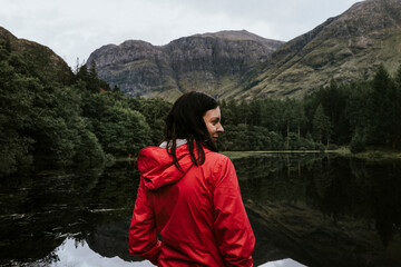 Woman standing by the riverside in the Highlands © Rawpixel.com