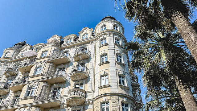Matisse apart hotel with ornate architecture and palm trees in Sochi, Russia