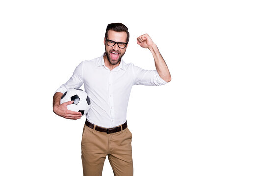 Photo of handsome excited guy with beard bristle watching football holding sport ball in hands supporting team isolated over grey collor background