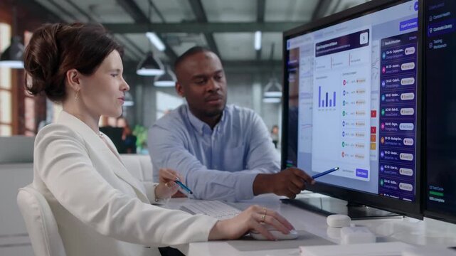 Compliance Manager And Colleague Review Risk Control Software