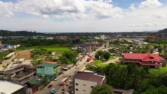 Car traffic, top view. Cityscape in the asian town. Road and streets in the town of Tacloban, Philippines. Summer and travel vacation concept.