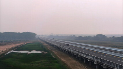 Fototapeta premium toll road with fire smoke in the background