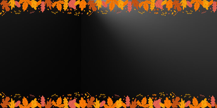 Autumn leaf border on black background, fall foliage frame for seasonal marketing, orange and yellow leaves on dark backdrop