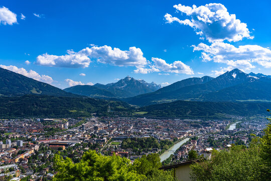 Aerial panorama view of Innsbruck city with peak Serles and the massif of Tyrolean alps from Hungerburg cable car station in spring, Innsbruck, Austria