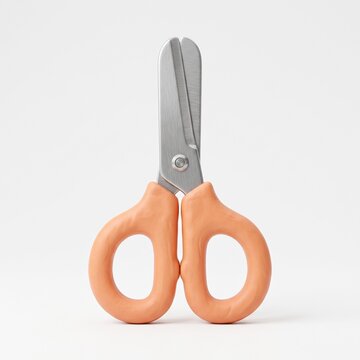 Pair of safety children scissors with rounded tips and light orange plastic handles isolated on a white background