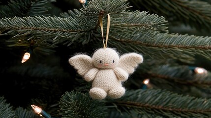 Fototapeta premium Delicate white angel wings gently suspended from an evergreen tree create a whimsical touch to the holiday atmosphere