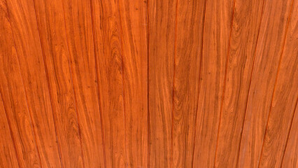 Obraz premium Seamless warm amber teak wood texture background with natural organic flame patterns and vertical grain lines.
