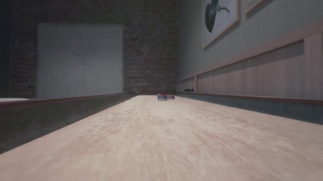 Slow motion two red shuffleboard pucks gliding toward the camera