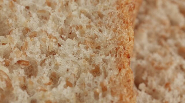 Wholemeal bread macro close up presentation slowly rotating stock footage