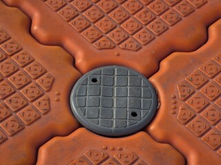 Close-Up of Interlocking Orange Modular Plastic Floating Pontoon Dock Block with Connecting Pin © Vladimir