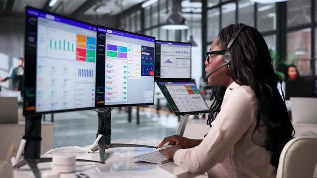 Call Center Agent Monitors Customer Service Dashboard Using Laptop