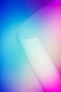 3D gradient ribbon cyan pink blue forms a soft luminous abstract background with translucent curves and dreamy color flow