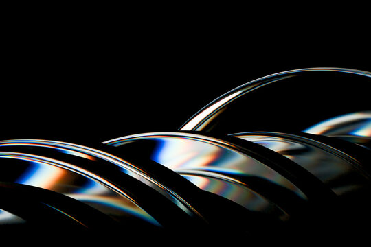 3D chrome arches black closeup create layered iridescent reflections with luminous highlights and dramatic abstract curvature