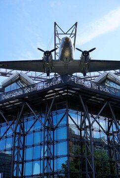 Front facade and entrance of Technikmuseum (Technology Museum Berlin) with the historic raisin bomber or candy plane; vertical