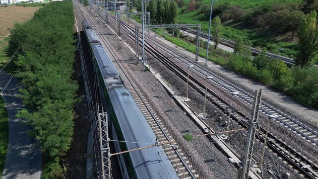 Europe, Italy , Milan - Frecciarossa Hight speed 300km h train railway from Milan  to Rome view from the drone - the faster way to travel in Italy for tourist and passengers - tourist destination 
