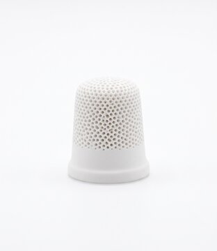 Soil tensiometer porous ceramic cup. Micro-machined white ceramic thimble with permeable pore structure for agronomy and soil moisture measurement. Isolated on a white background.