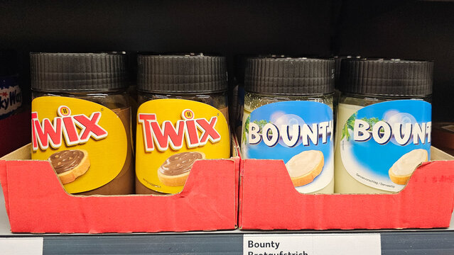 Twix and bounty chocolate spread jars on shelf