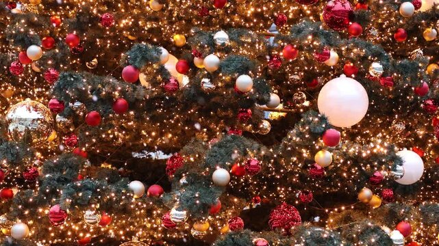 Festive Christmas background with glowing lights, ornaments and falling snow