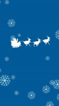 Animation of snowflakes falling over santa claus in sleigh being pulled by reindeers