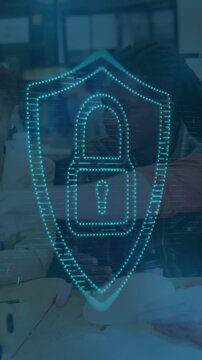 Animation of padlock in shield over diverse designers discussing about design in office