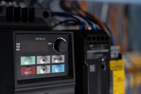 Variable frequency drive control panel managing industrial equipment