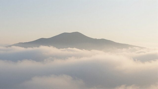 Simple cloud sea mountain landscape background with distant peaks and pale sunrise sky