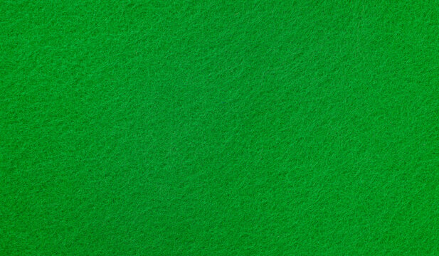 Abstract green felt texture background with soft fabric surface pattern and natural fiber detail