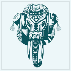 Stylized teal elephant head with tribal, mandala designs, and tassels. A detailed silhouette serving as an ethnic symbol for spiritual or decorative use. © Rysak