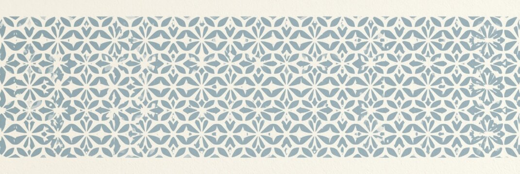 Seamless small geometric quatrefoil tile pattern in muted blue and cream for wallpaper border and textile design