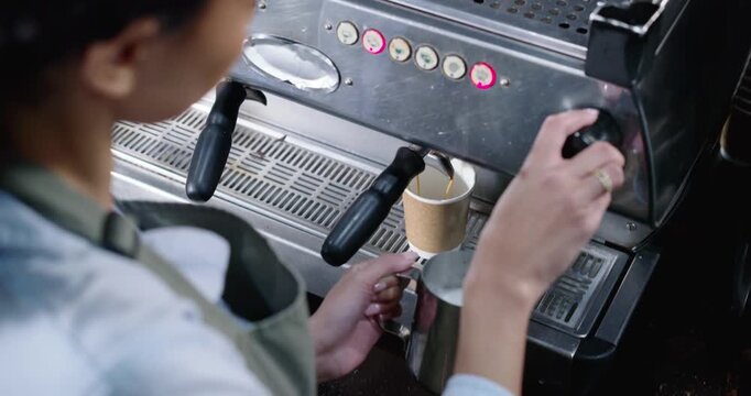 African American woman making to-go coffee at counter placing cup steaming jug pouring, copy space