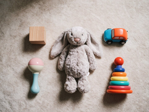 Toys Arranged On Soft Surface: A Collection Representing Childhood Joy And Innocence