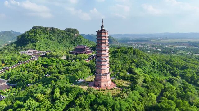 Aerial View of Bai Dinh Pagoda Stupa in Ninh Binh, Vietnam, Showcasing Buddhist Architecture Surrounded by Scenic Limestone Mountains
