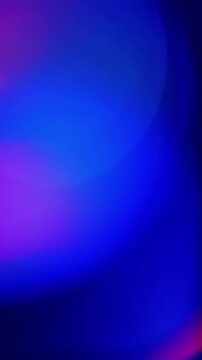 Abstract colors shift in vertical video. Soft blue, purple and orange shapes move across a dark background.