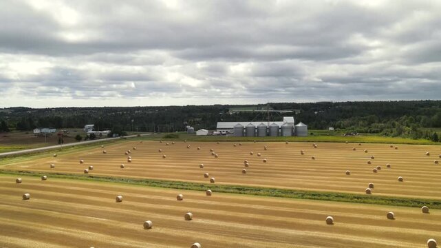 Farmland and grain silos pan left in Prince Edward Island, Canada