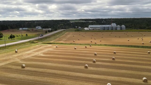 Farmland and rural road with truck in Prince Edward Island, Canada