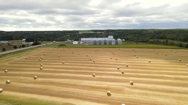 Aerial pan right of countryside highway and PEI farmland, Canada