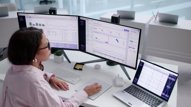 Business Analyst Carefully Building Interactive Dashboards On Laptop