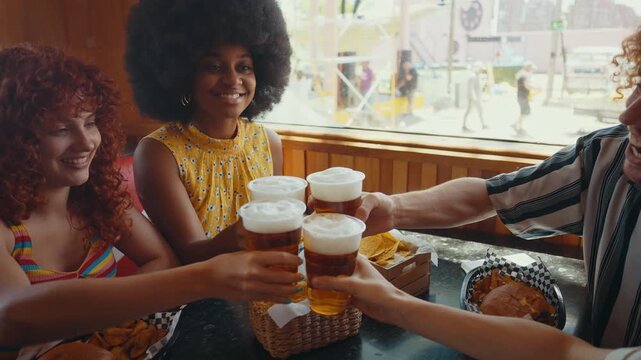 Cinematic footage about a group of multi-ethnic friends eating and having fun in an american styled diner restaurant.
