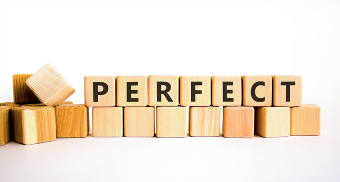 Perfect word symbol. Concept word Perfect on beautiful wooden blocks. Beautiful white table white background. Business perfect word concept. Copy space.
