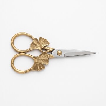 Vintage Brass Embroidery Scissors with Ginkgo Biloba Leaf Handle Isolated on White Background