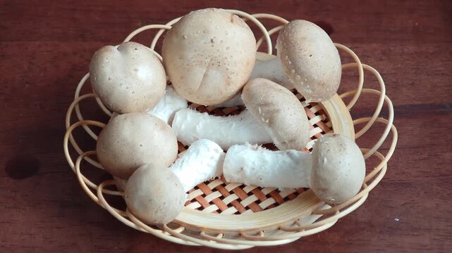 a basket of mushrooms in white 