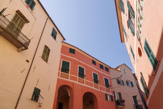 Colorful facades of houses in the historic center of Imperia, Liguria region, Italy