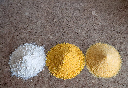 Three varieties of corn flour for banosh on kitchen countertop